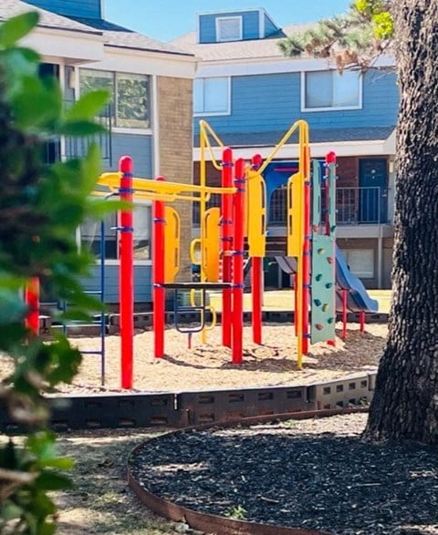 a colorful playground in front of a building